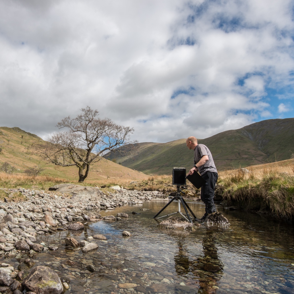 Rob Fraser with a 10x8 Ilford Titan Pinhole camera making an image of the Trout Beck Alder for The Long View